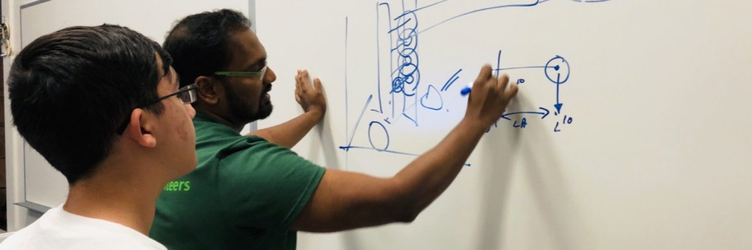 A volunteer from Microsoft begins to mockup a student's engineering project idea.